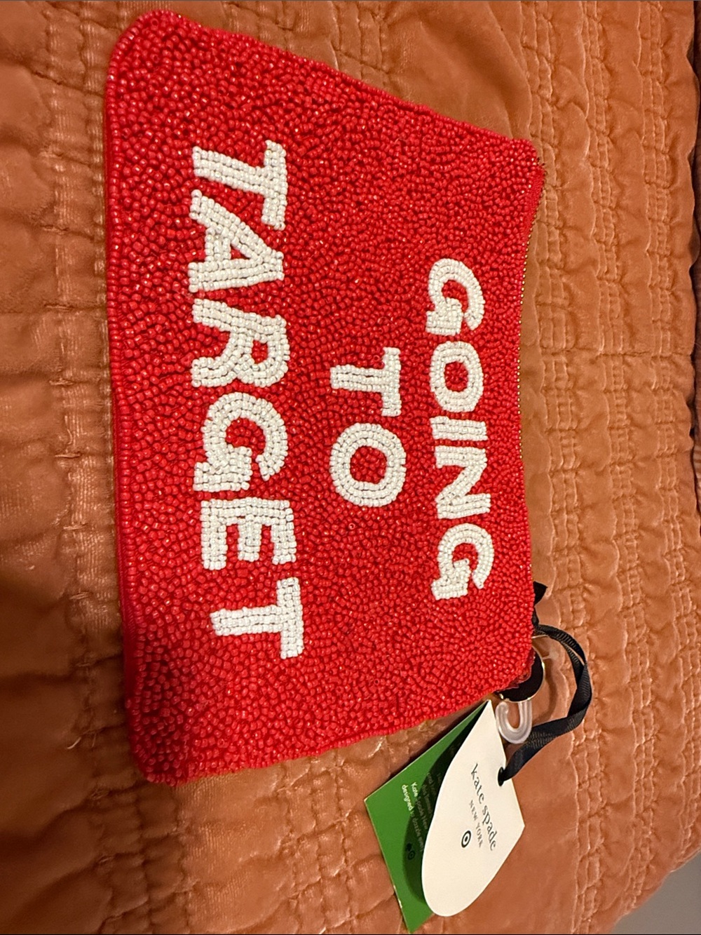 kate spade red beaded 'Going to Target' pouch with white lettering